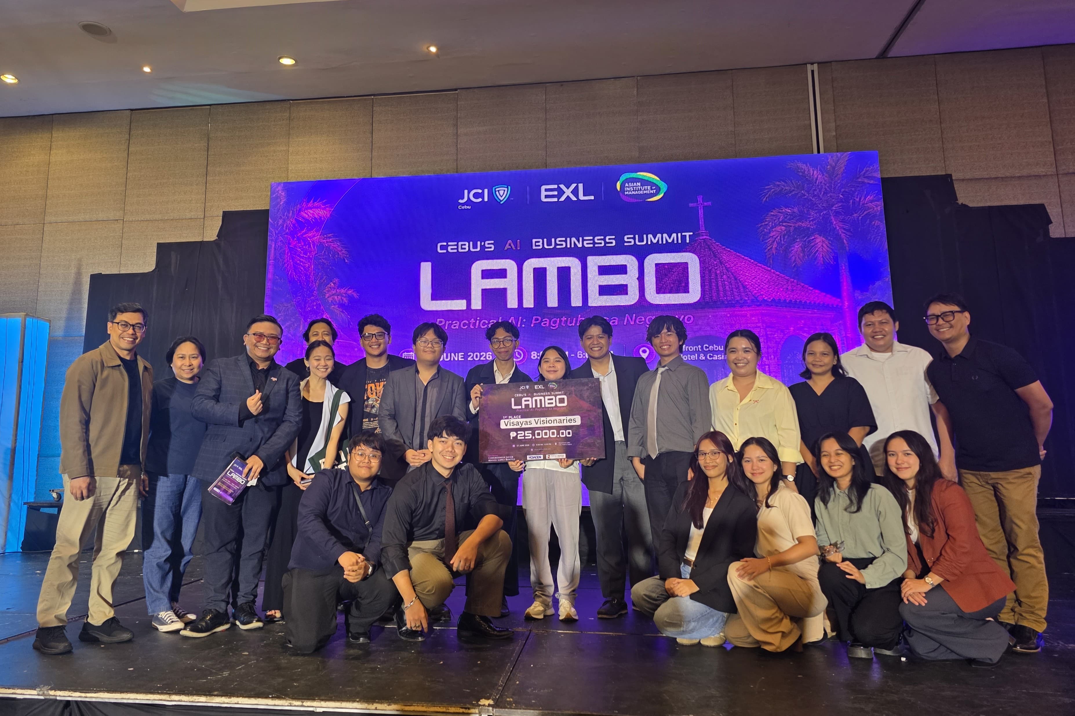 Nathanael Larida and fellow LAMBO 2026 participants posing together on the business summit stage